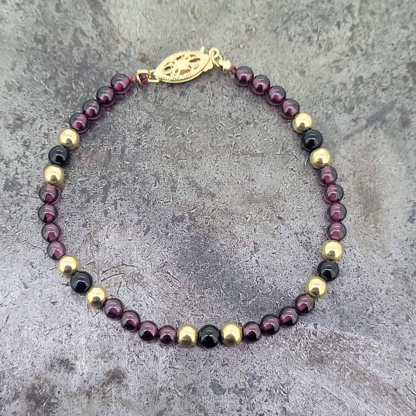 Garnet, Gold, and Black Onyx Bead Bracelet
