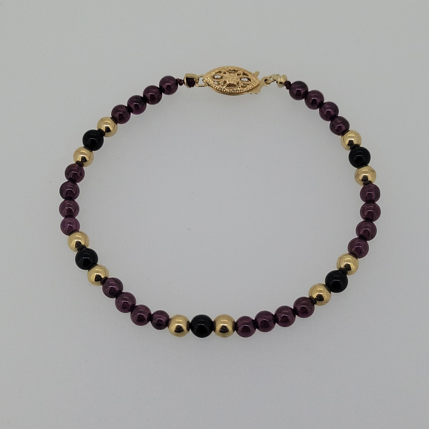 Garnet, Gold, and Black Onyx Bead Bracelet